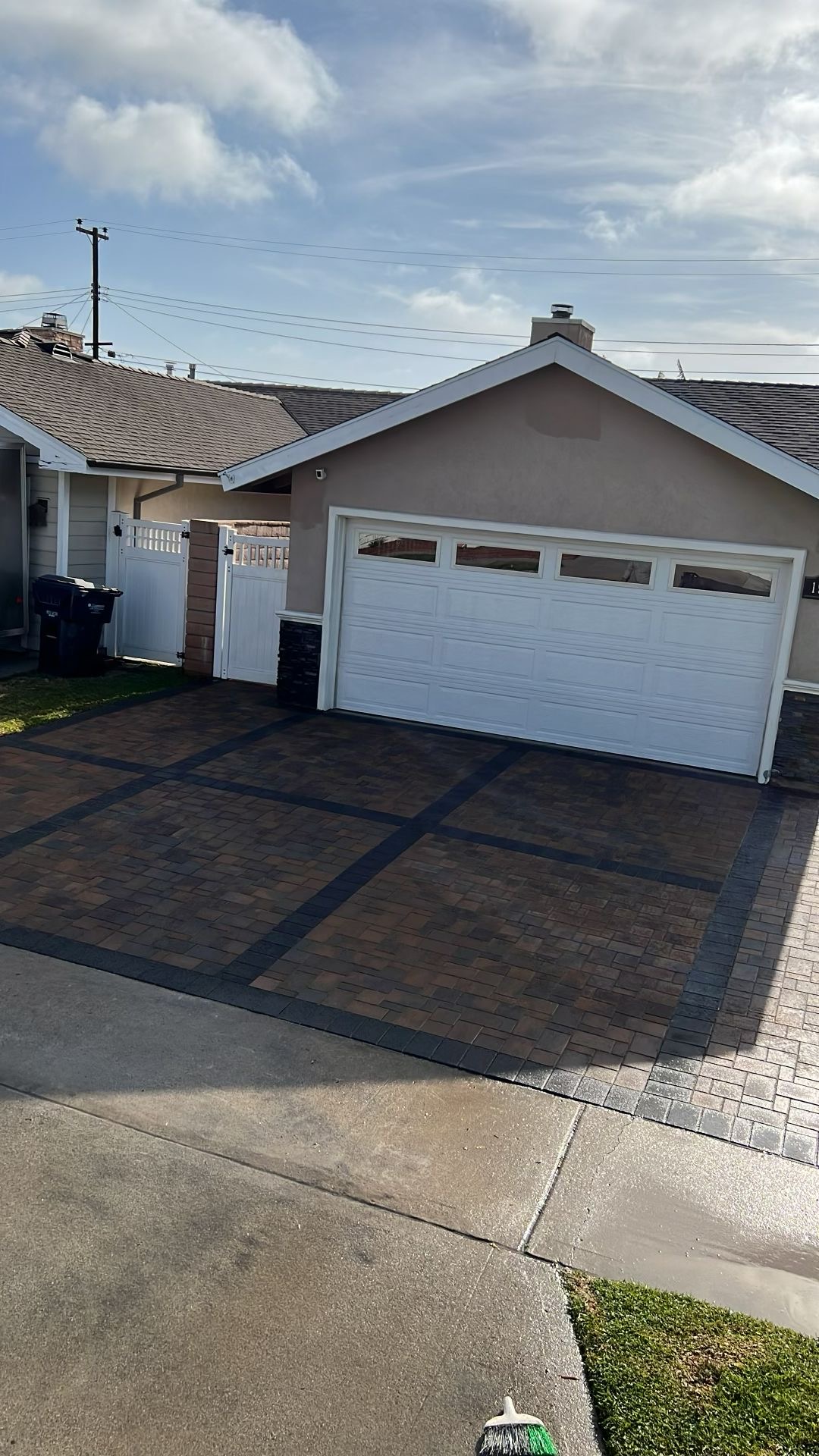 Paver driveway with decorative dark border pattern