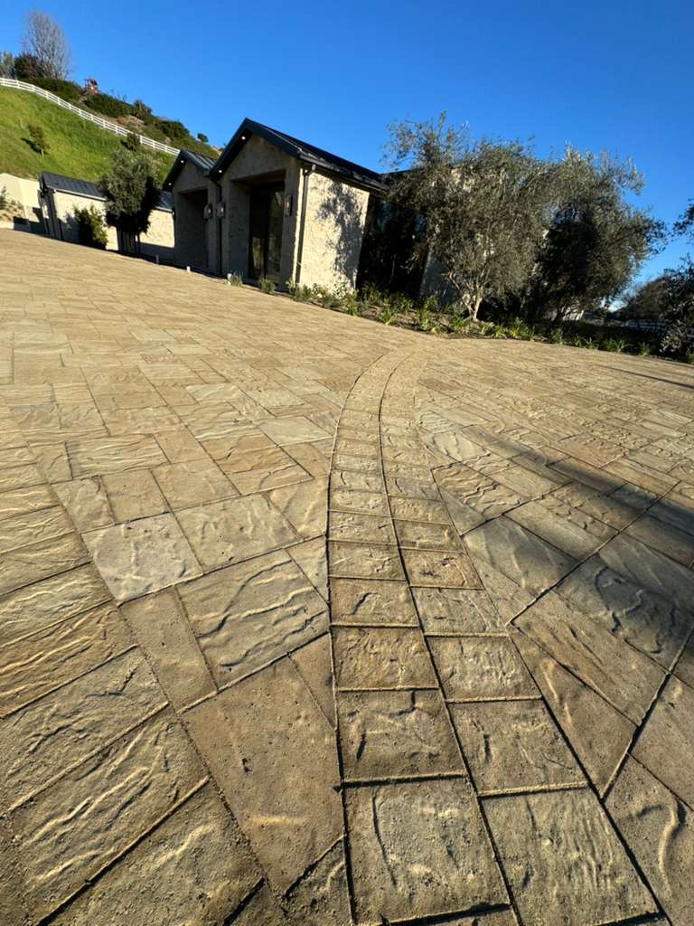 Estate stamped paver driveway with curved decorative band detail