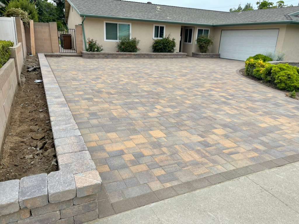 Multi-color paver driveway with retaining wall border